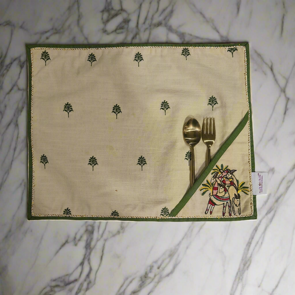 Embroidered table placemats with cutlery holder in beige and green with intricate floral and animal design