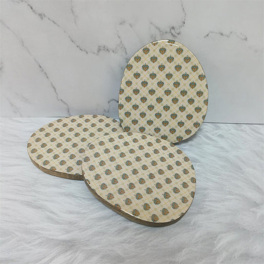 Samaa India designer trivets for hot dishes with elegant traditional patterns on round wooden surfaces