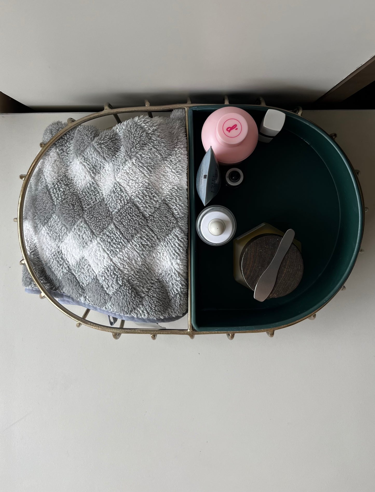 Samaa India metal bathroom vanity tray with divided compartments holding towel and toiletries