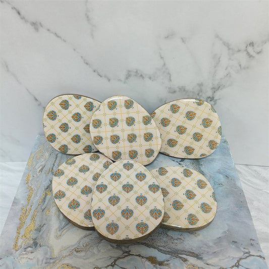 Samaa India luxury oval coasters set with intricate blue and gold floral patterns on white background